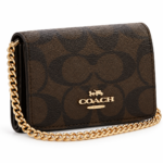 شنطة  Coach صغيرة بحزام سلسلة ذهبية سيجنتشر بني أنيق.